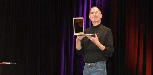Steve Jobs holding MacBook Air Steve Jobs and MacBook Air