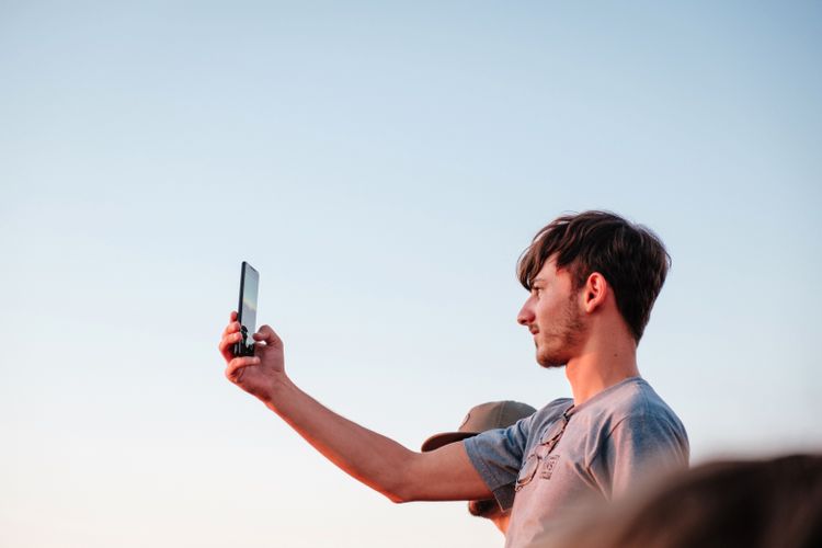 person taking selfie with phone